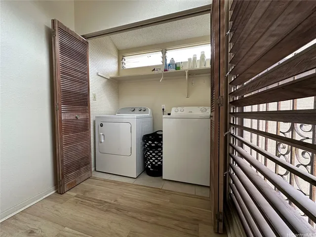 a view of a storage & utility room with washer and dryer