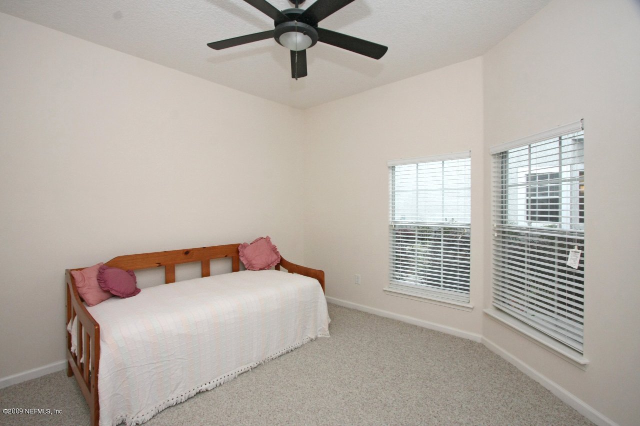 3109 Ravines Road Middleburg, FL 32068 - Photo 13 of 14 a bedroom with a bed and a window