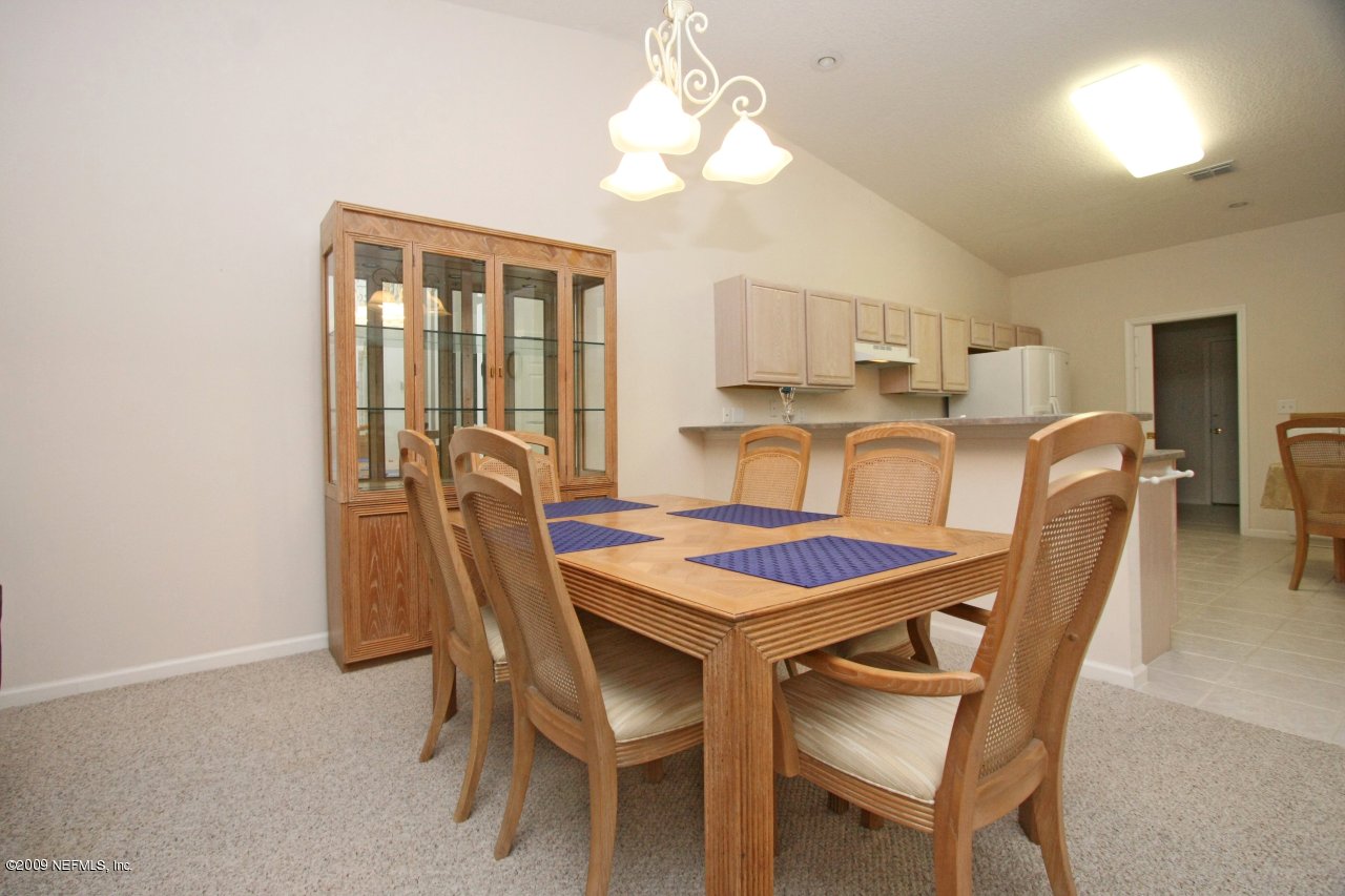 3109 Ravines Road Middleburg, FL 32068 - Photo 3 of 14 a view of a dining room with furniture and window