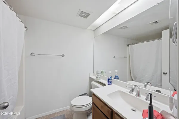 a bathroom with a sink toilet and vanity