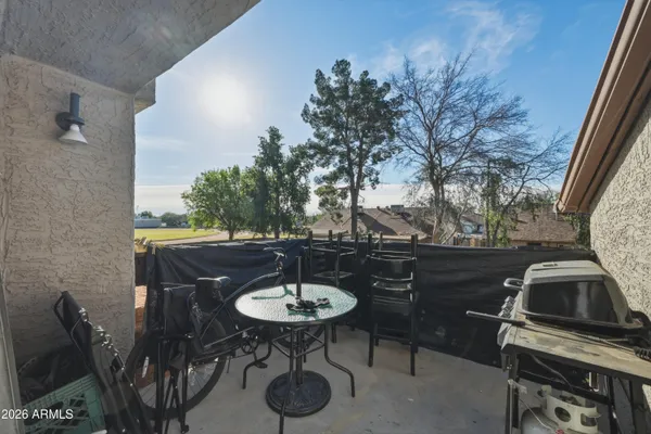 a view of a chairs and table in patio