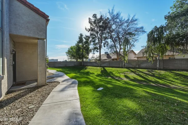 a backyard of a house with lots of green space