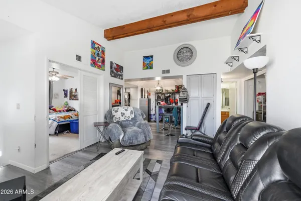 a living room with furniture and a clock