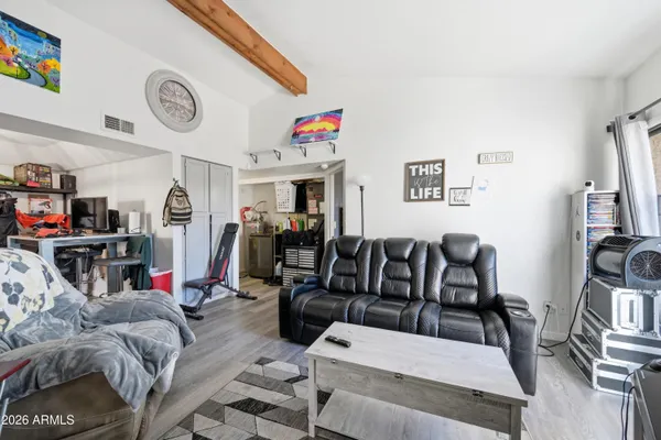 a view of a livingroom with furniture and a flat screen tv