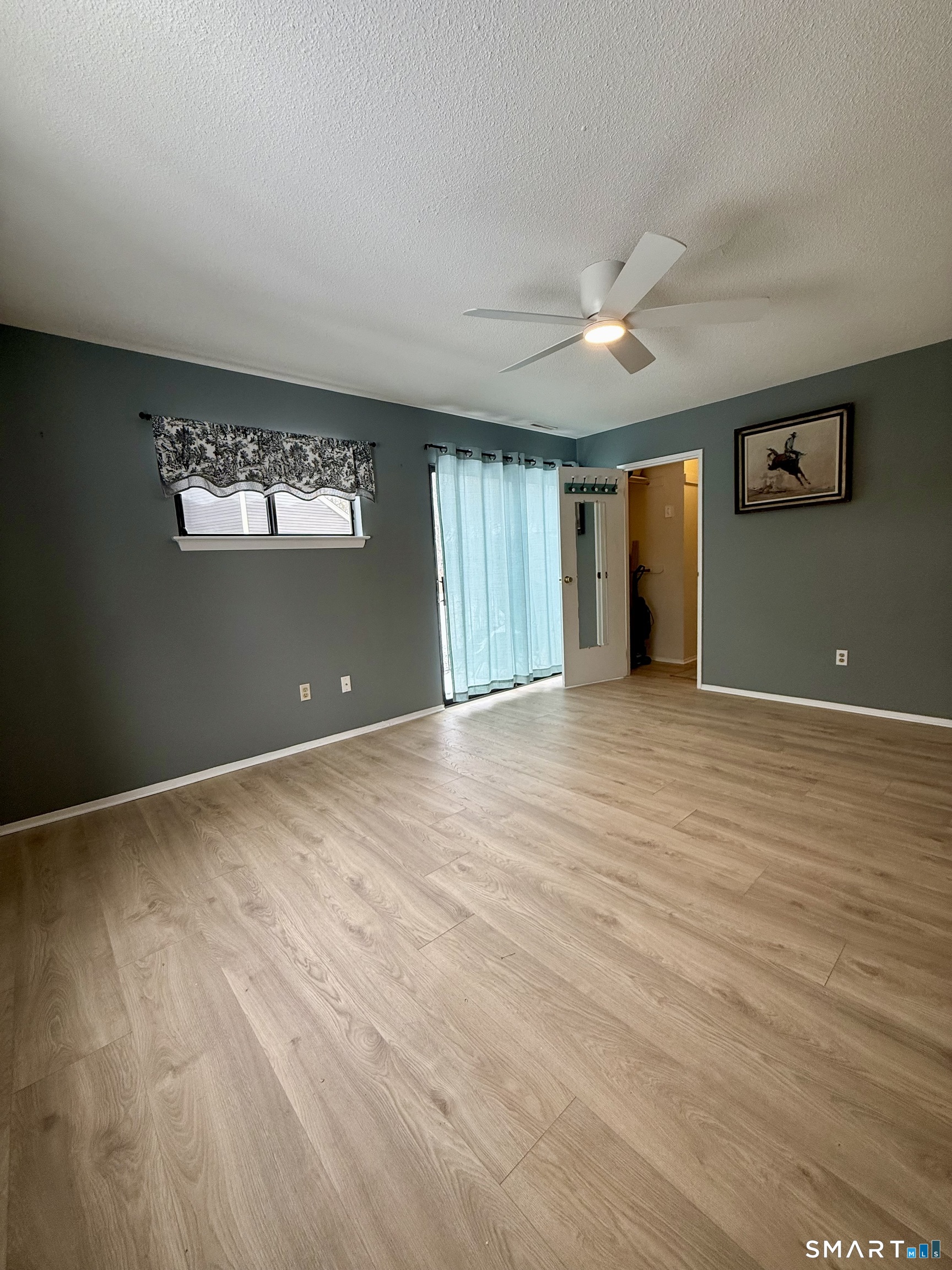 6 Stonegate Circle, Unit A Branford, CT 06405 - Photo 13 of 19 a view of empty room with wooden floor