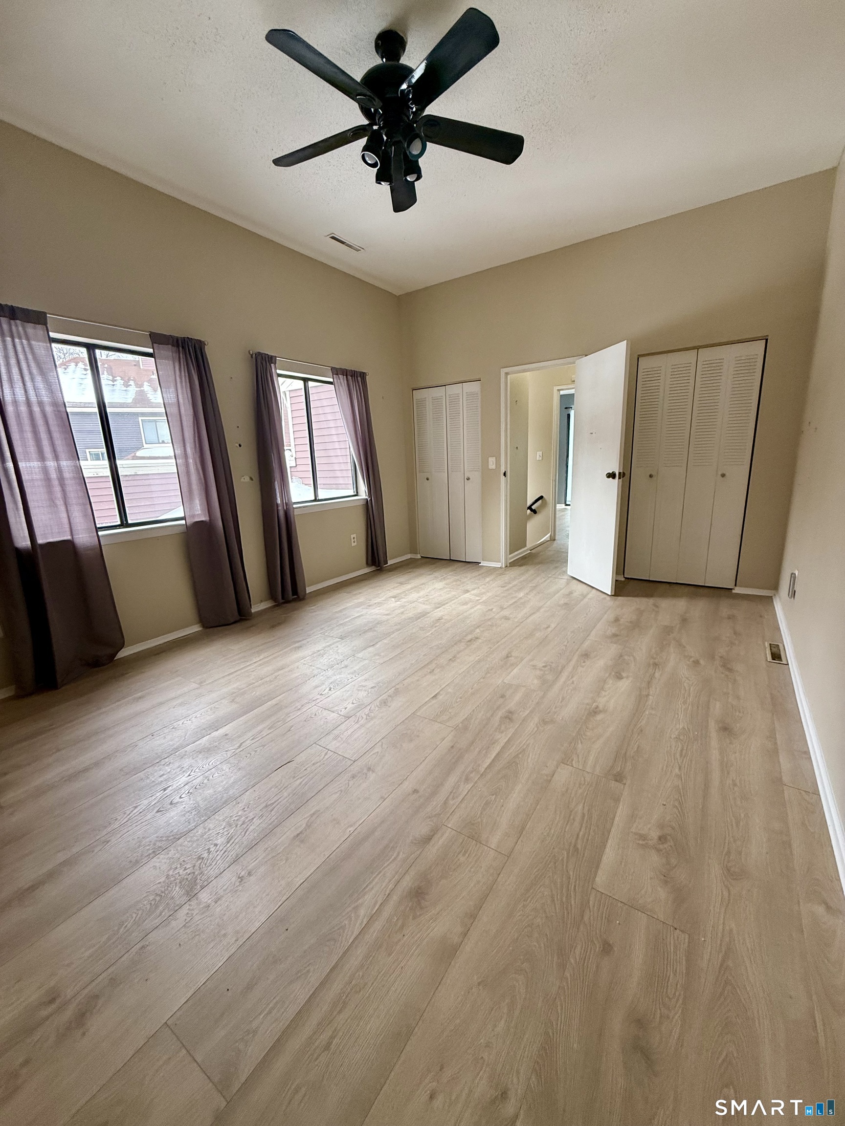 6 Stonegate Circle, Unit A Branford, CT 06405 - Photo 15 of 19 wooden floor in an empty room with a window