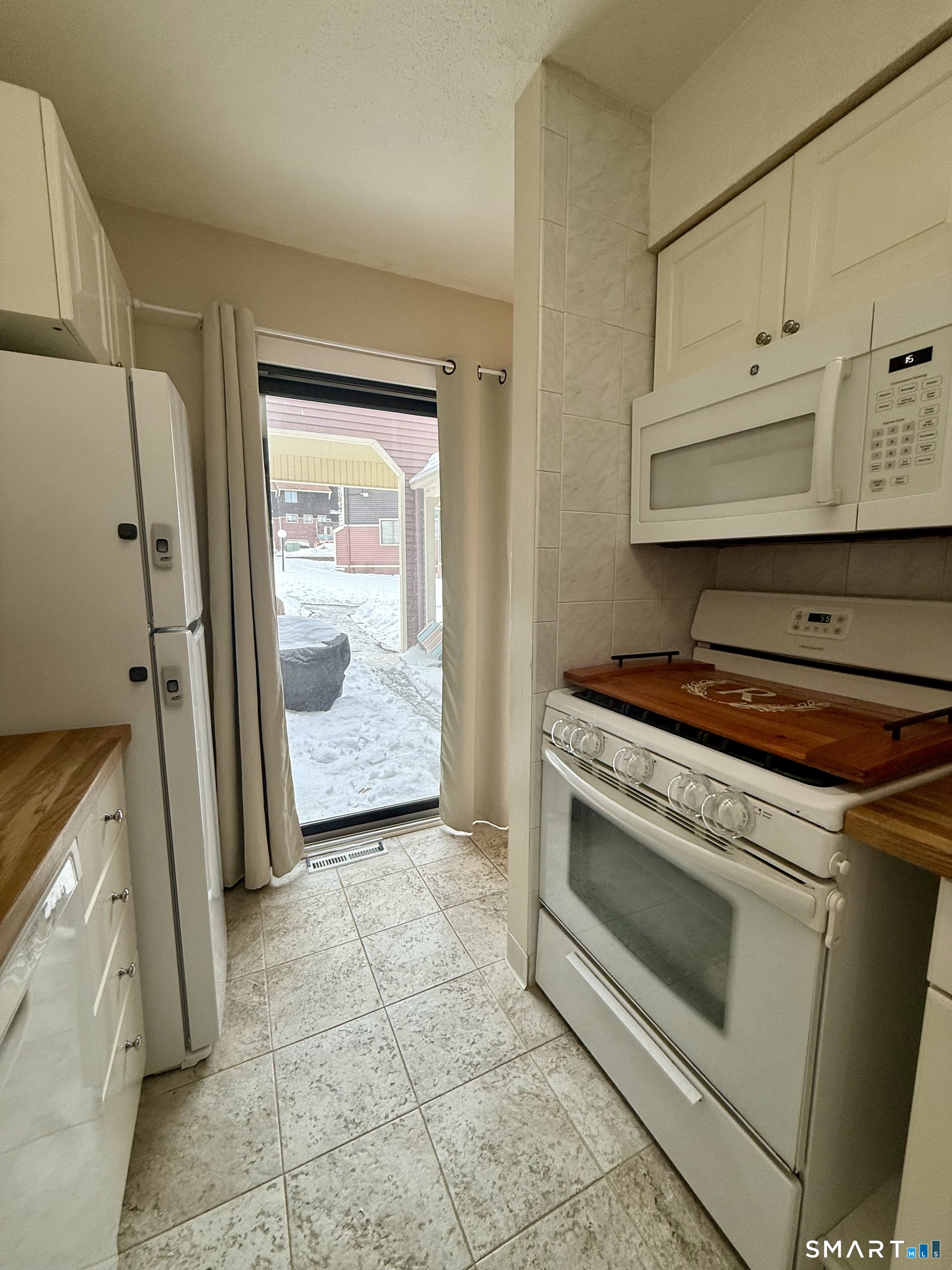 6 Stonegate Circle, Unit A Branford, CT 06405 - Photo 10 of 19 a view of a kitchen with appliances and cabinets