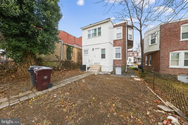 a view of a patio with a yard