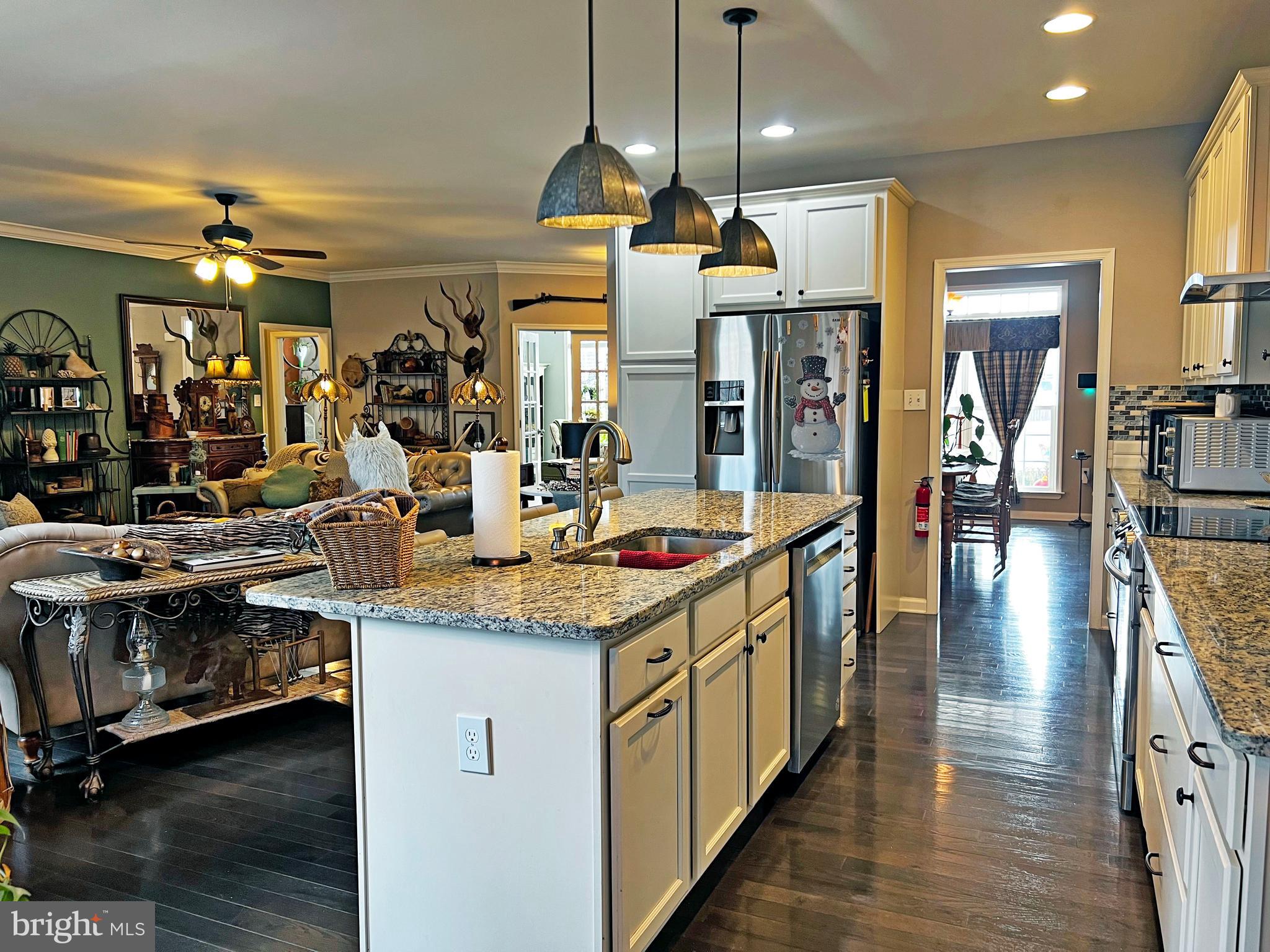 101 Trout River Terrace Falling Waters, WV 25419 - Photo 12 of 57 a kitchen with stainless steel appliances granite countertop a sink and a stove