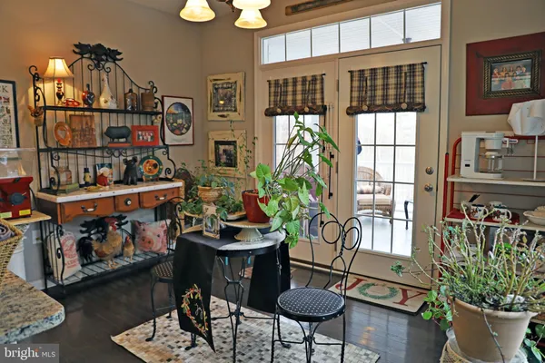 a bedroom with a bed chair and dresser