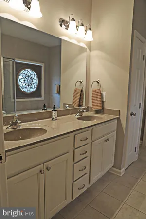 a bathroom with a tub and a shower