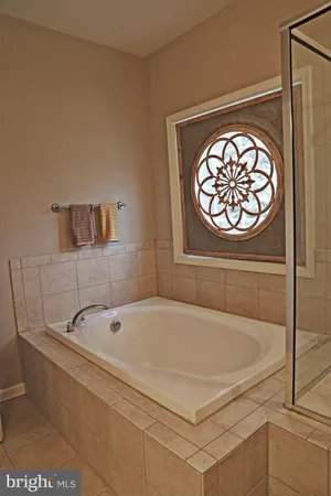 a bedroom with a bed and a mirror