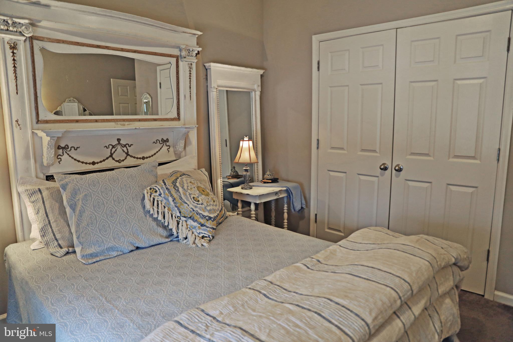 101 Trout River Terrace Falling Waters, WV 25419 - Photo 22 of 57 a bedroom with a bed and a table