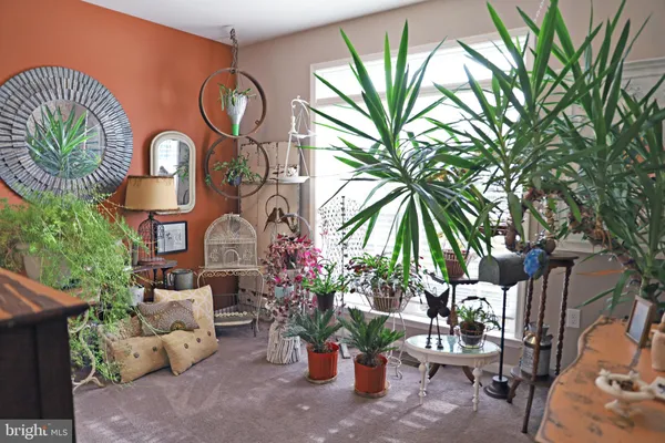 a living room with furniture and a table