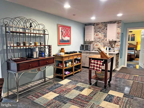 a living room with lots of furniture and rug