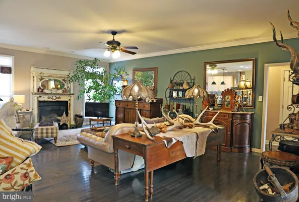 a kitchen with stainless steel appliances granite countertop a sink a stove and cabinets