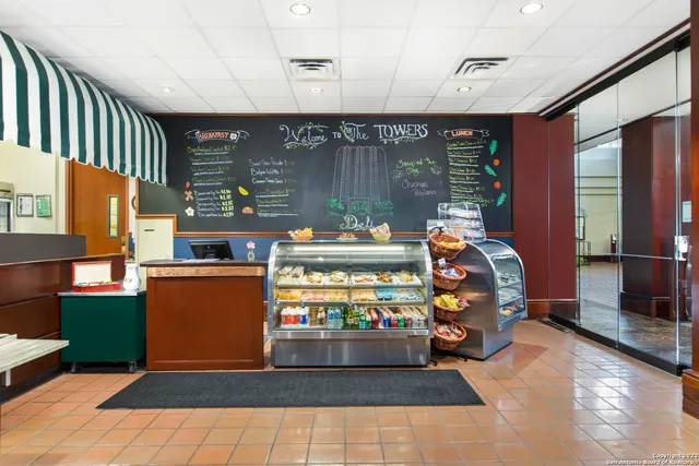 a view of a dining room with furniture wooden floor and a window