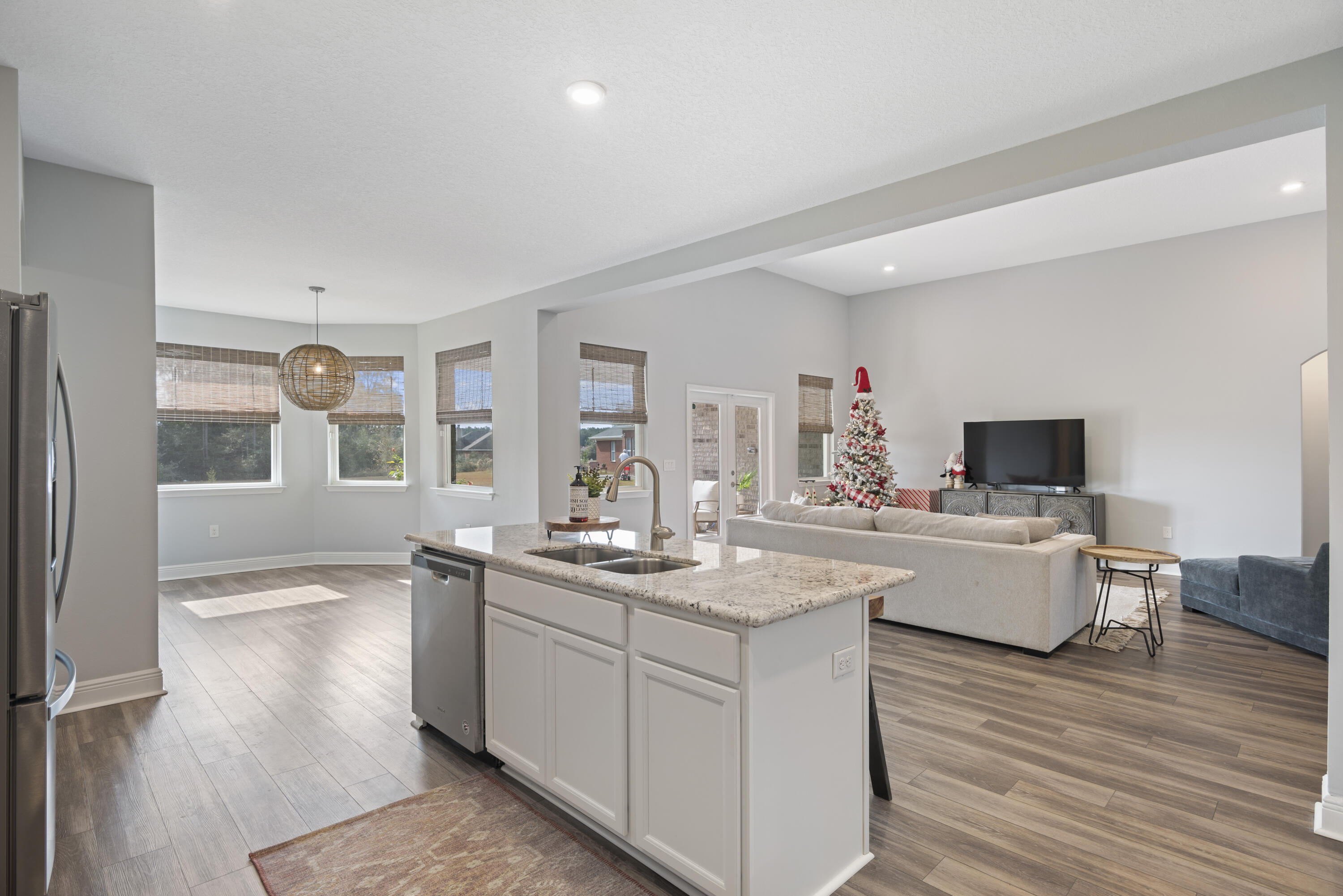 32 Brushed Dune Circle Freeport, FL 32439 - Photo 15 of 34 a kitchen with a sink and wooden floor