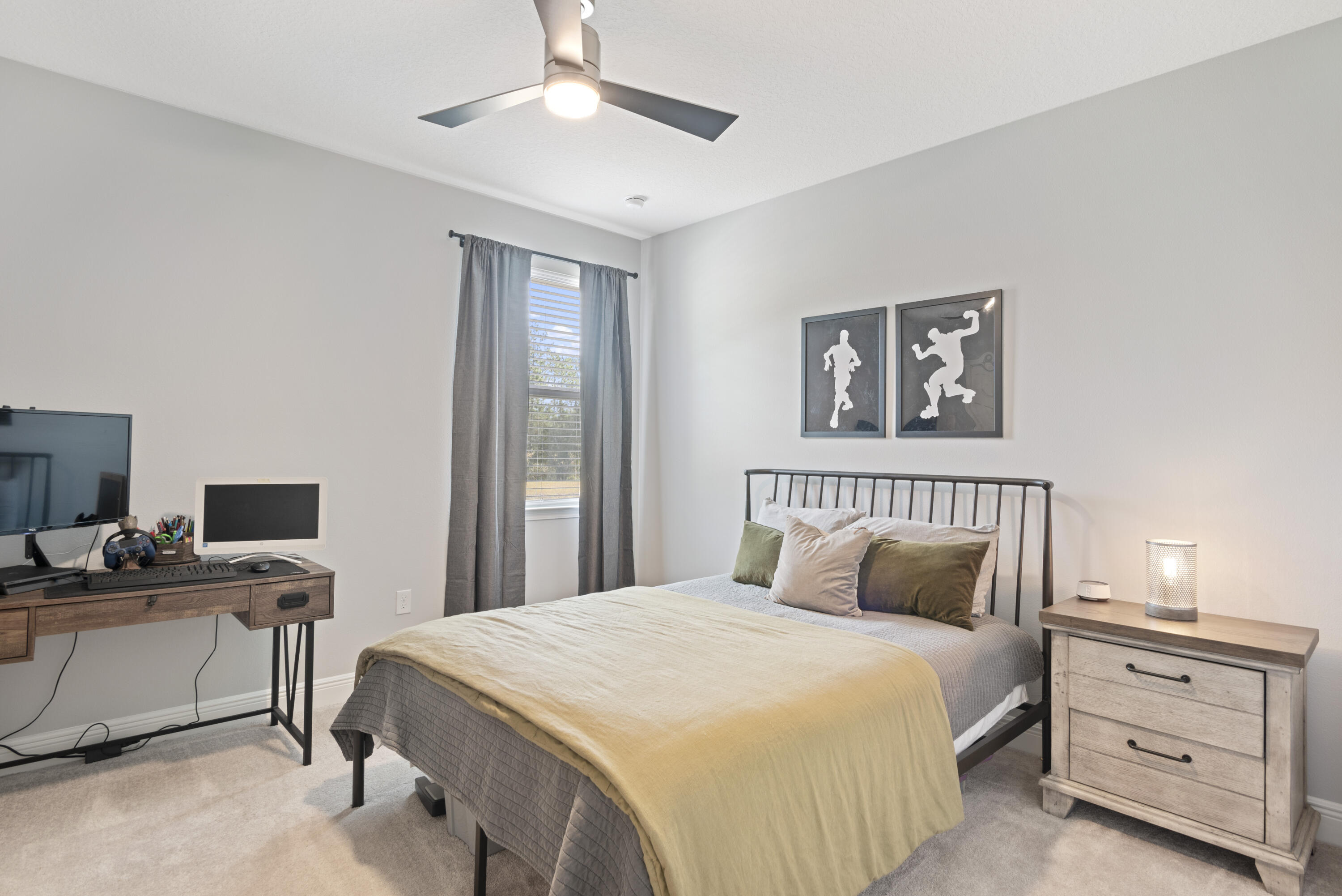 32 Brushed Dune Circle Freeport, FL 32439 - Photo 23 of 34 a bedroom with a bed and a chandelier