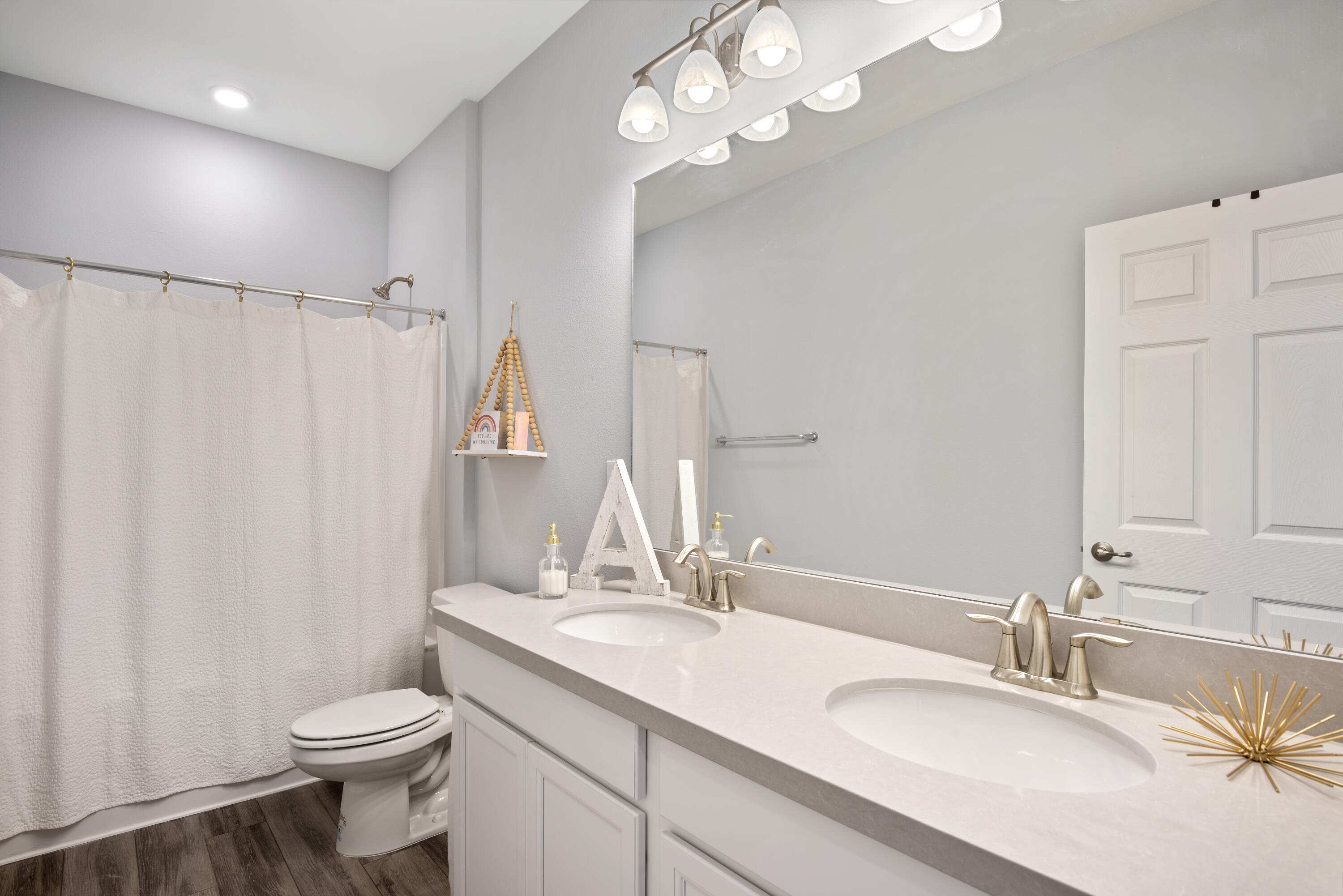 32 Brushed Dune Circle Freeport, FL 32439 - Photo 26 of 34 a bathroom with a double vanity sink mirror and toilet