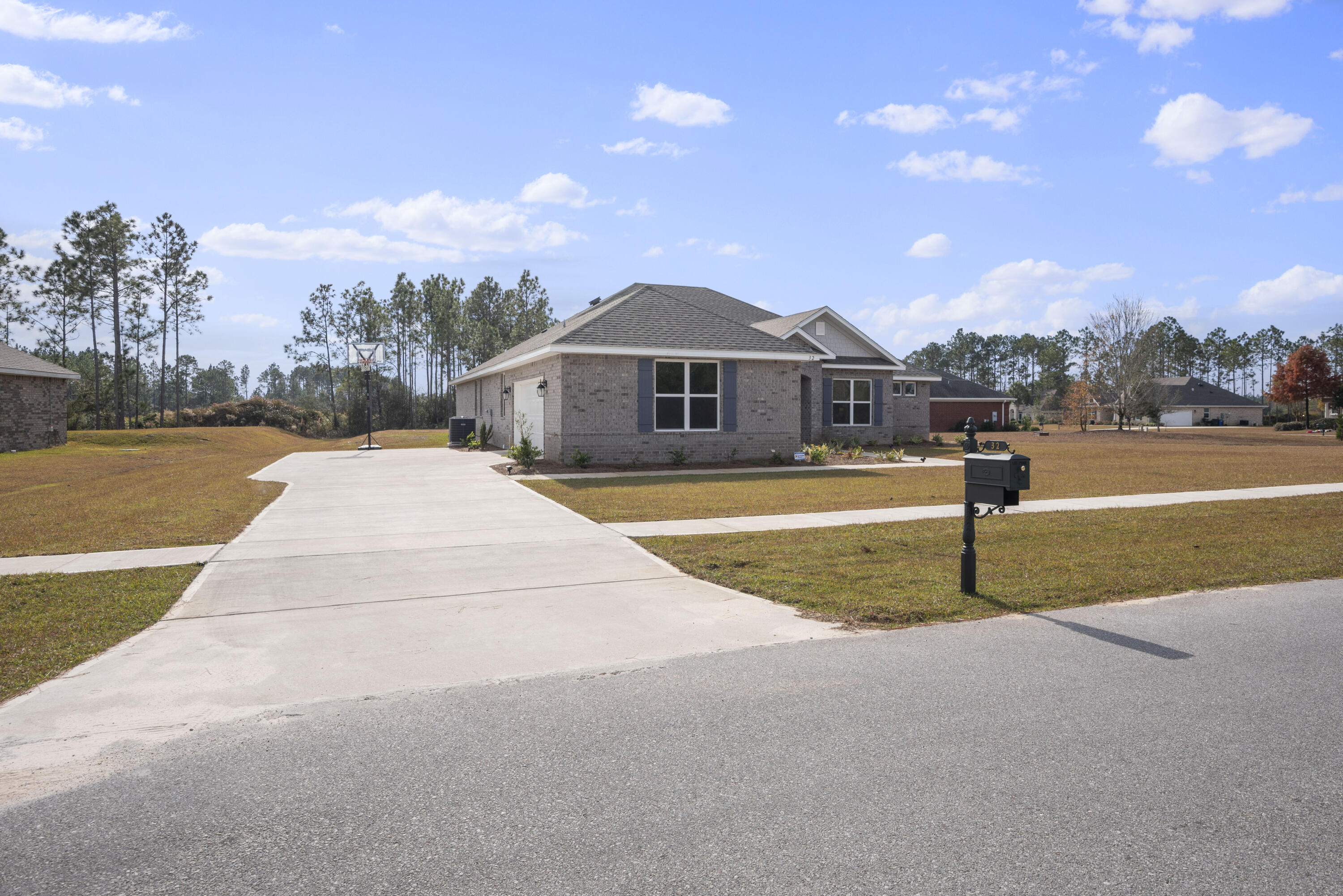 32 Brushed Dune Circle Freeport, FL 32439 - Photo 3 of 34 a front view of a house with a yard