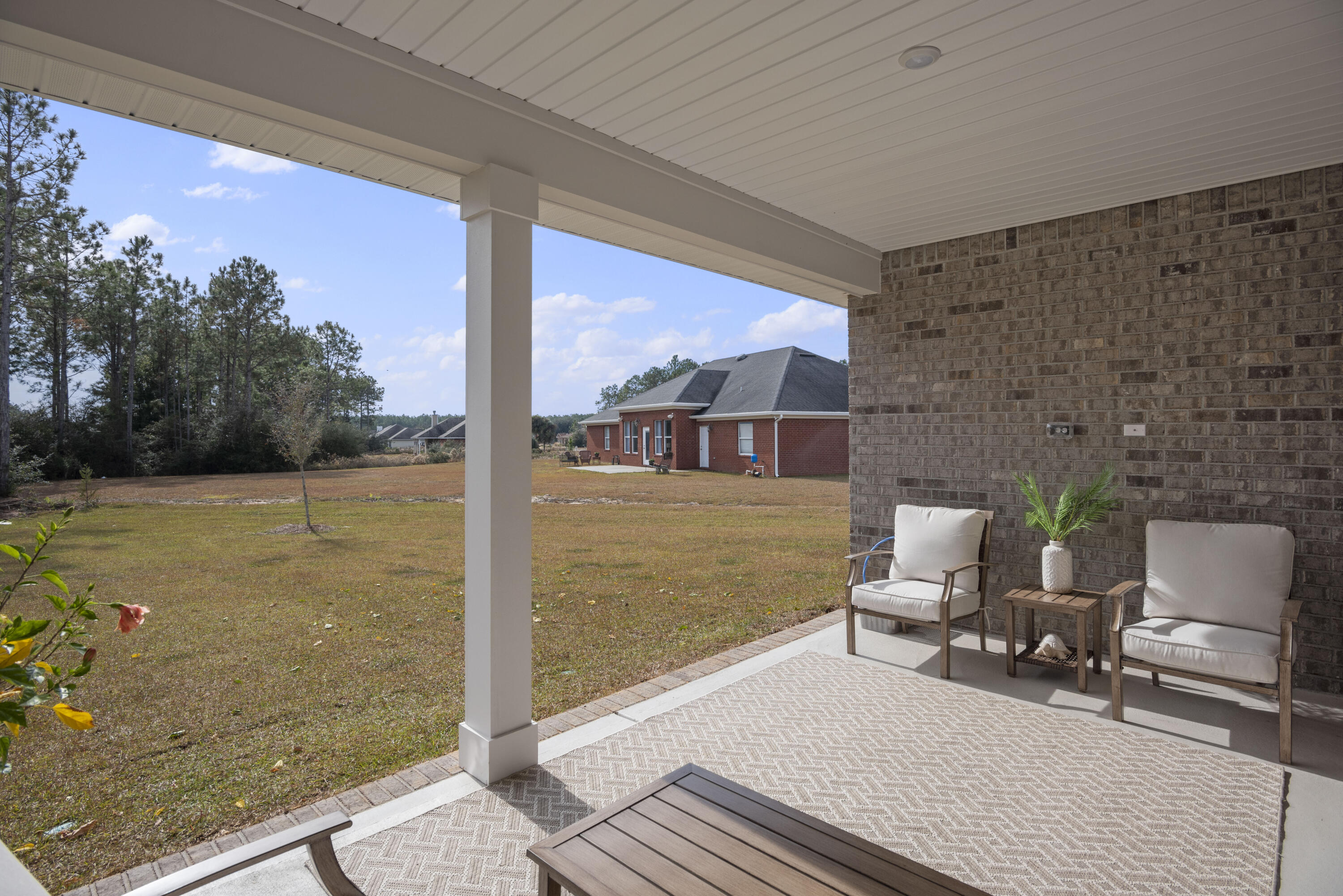 32 Brushed Dune Circle Freeport, FL 32439 - Photo 32 of 34 a balcony with table and chairs