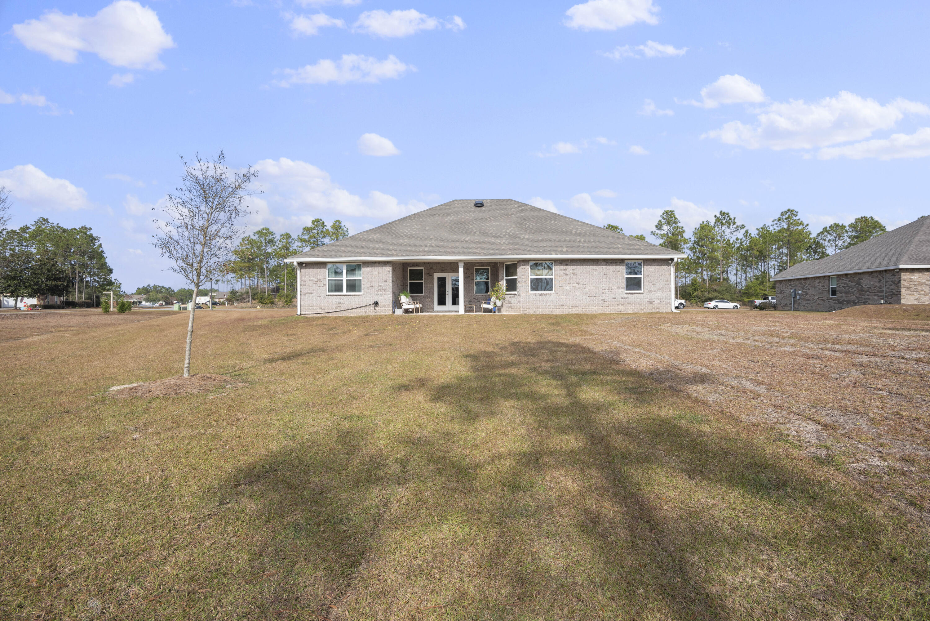 32 Brushed Dune Circle Freeport, FL 32439 - Photo 34 of 34 a front view of a house with a yard and trees