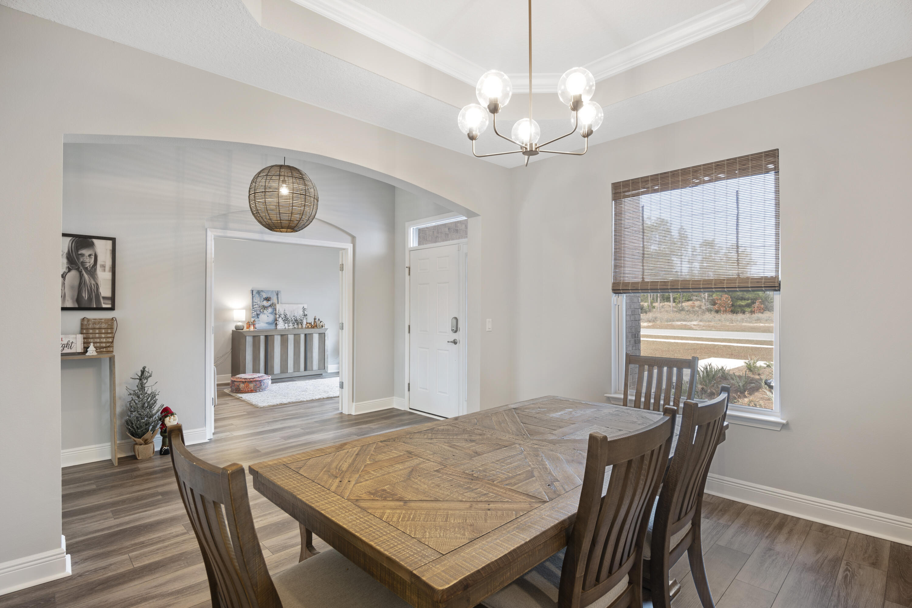 32 Brushed Dune Circle Freeport, FL 32439 - Photo 6 of 34 a view of a dining room with furniture wooden floor and chandelier
