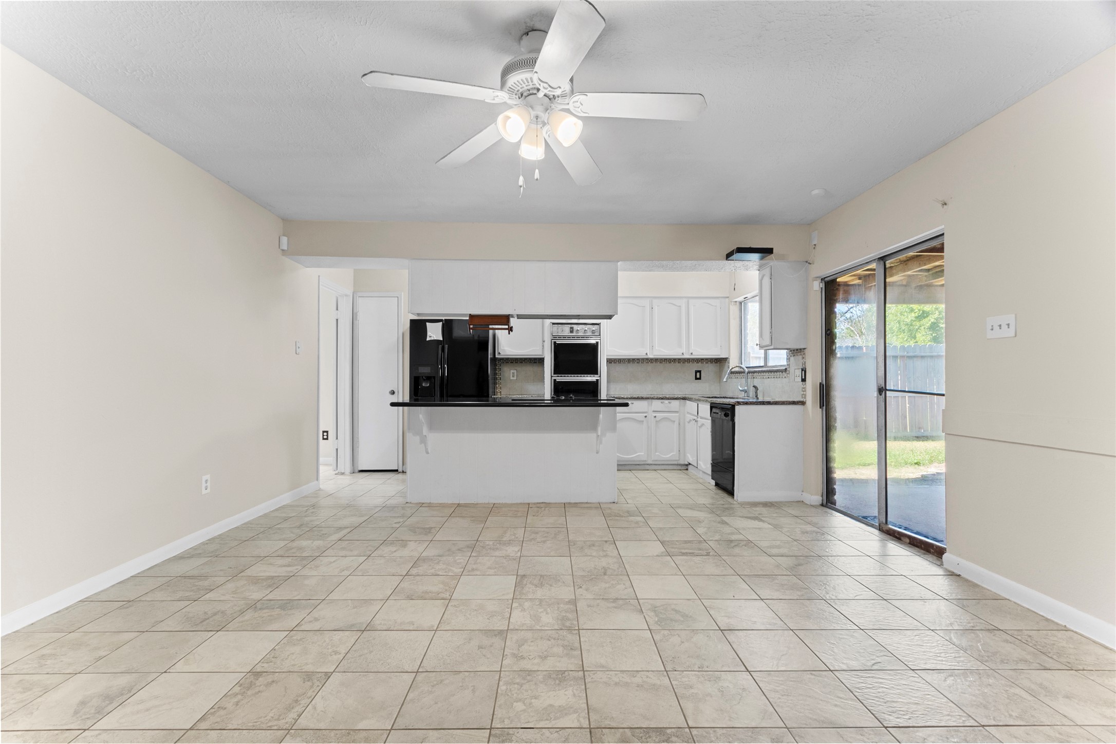 6630 Brownie Campbell Road Houston, TX 77086 - Photo 11 of 28 a view of kitchen with stainless steel appliances cabinets and a sink