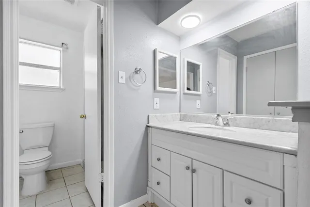 a view of a backyard with wooden fence