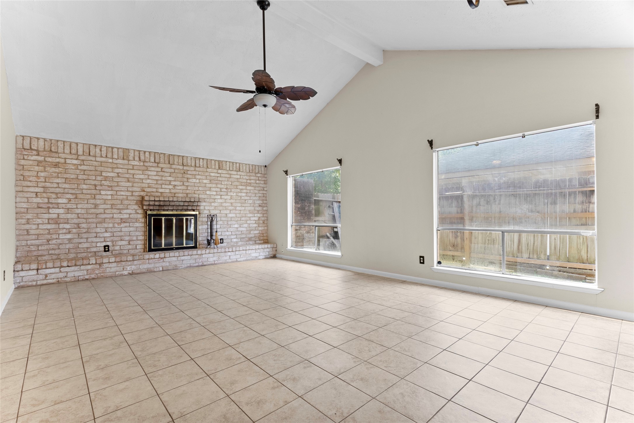 6630 Brownie Campbell Road Houston, TX 77086 - Photo 4 of 28 a view of an empty room with a fireplace and a window