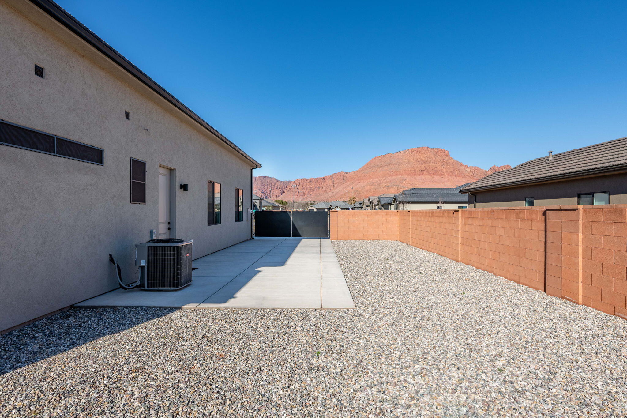 227 United Way Ivins, UT 84738 - Photo 22 of 28 Extended RV pad, double wide with ample space for parking, storage, or additional outdoor use.