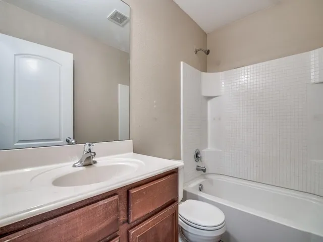 a bathroom with a sink toilet and a bathtub