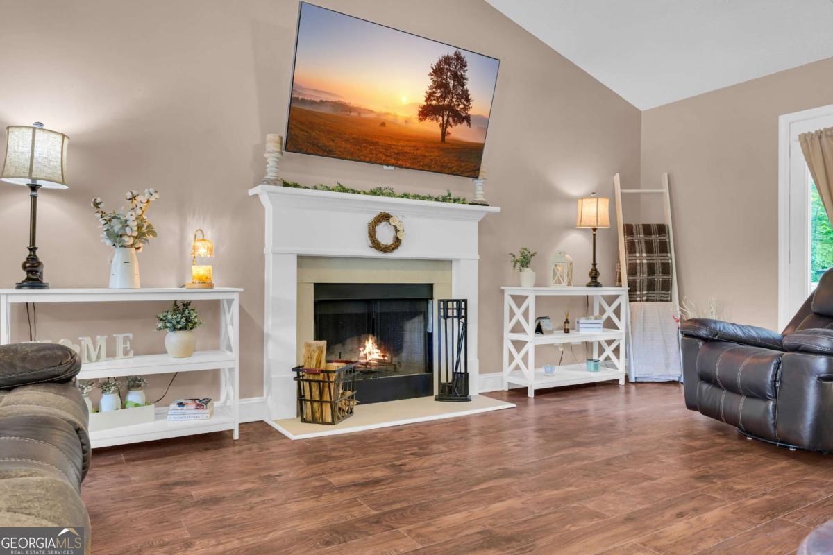 335 Elizabeth Court Colbert, GA 30628 - Photo 7 of 33 a living room with furniture and a fireplace