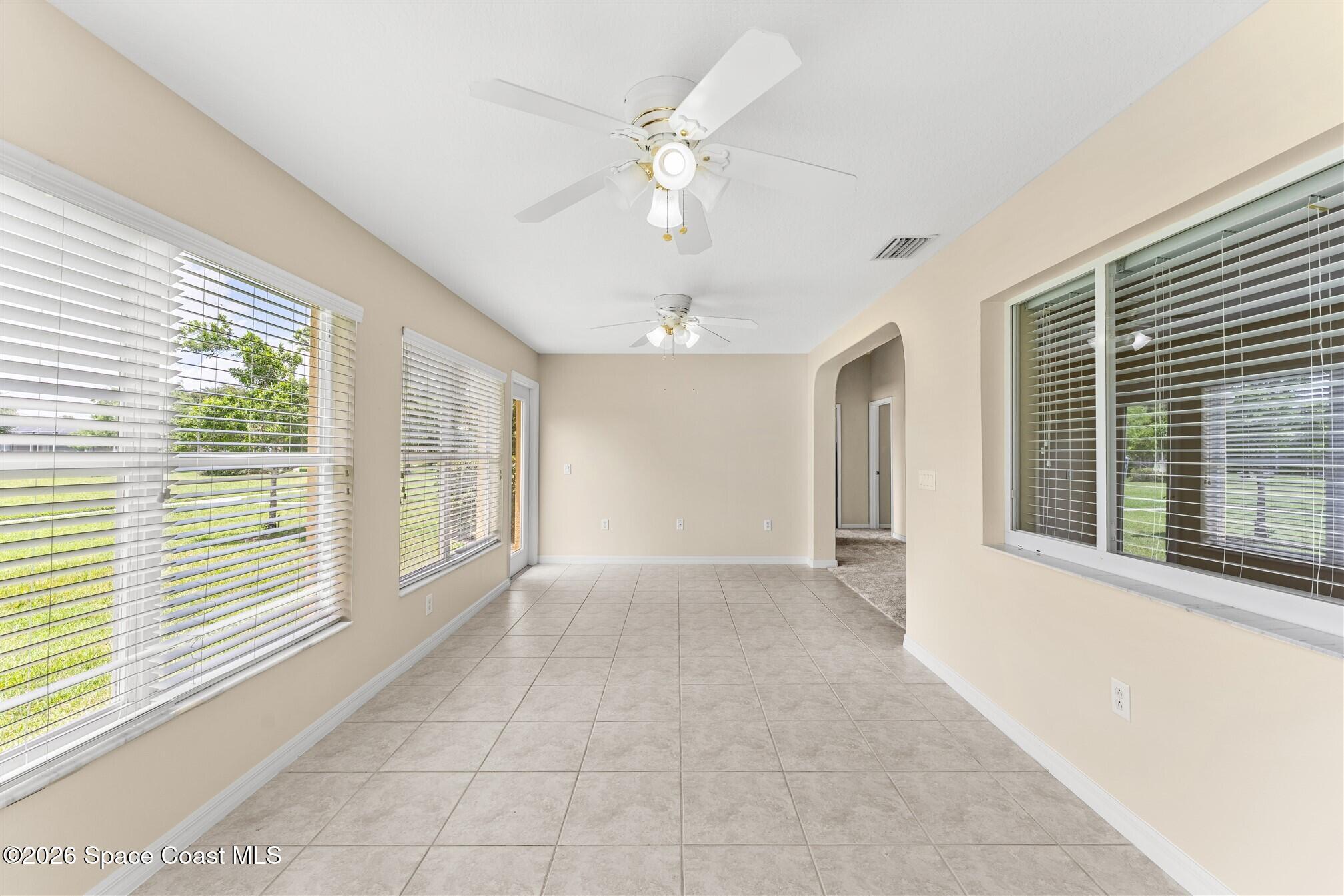 6904 Renshaw Drive Melbourne, FL 32940 - Photo 18 of 46 a view of an empty room with a window