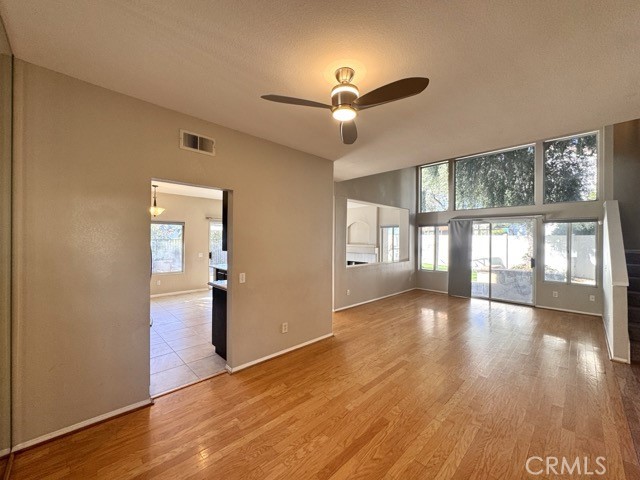 40085 Temecky Way Murrieta, CA 92562 - Photo 11 of 55 a view of an empty room with wooden floor and a window