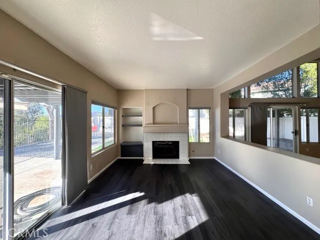 a view of kitchen with refrigerator and window