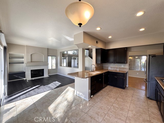 40085 Temecky Way Murrieta, CA 92562 - Photo 18 of 55 a large kitchen with a stove and cabinets