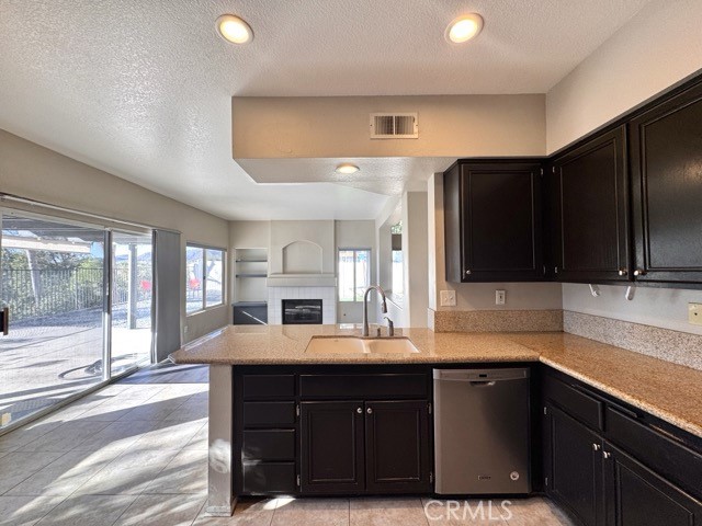 40085 Temecky Way Murrieta, CA 92562 - Photo 19 of 55 a kitchen with a sink and cabinets