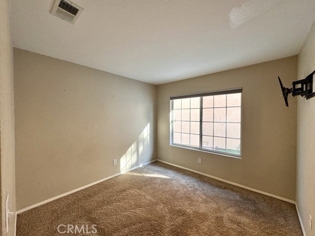 40085 Temecky Way Murrieta, CA 92562 - Photo 21 of 55 an empty room with a empty space and windows