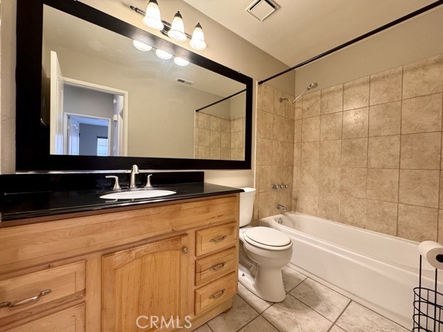 40085 Temecky Way Murrieta, CA 92562 - Photo 24 of 55 a bathroom with a sink a toilet and a mirror