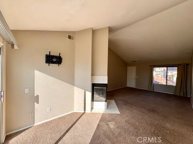 a bathroom with a granite countertop sink and a toilet