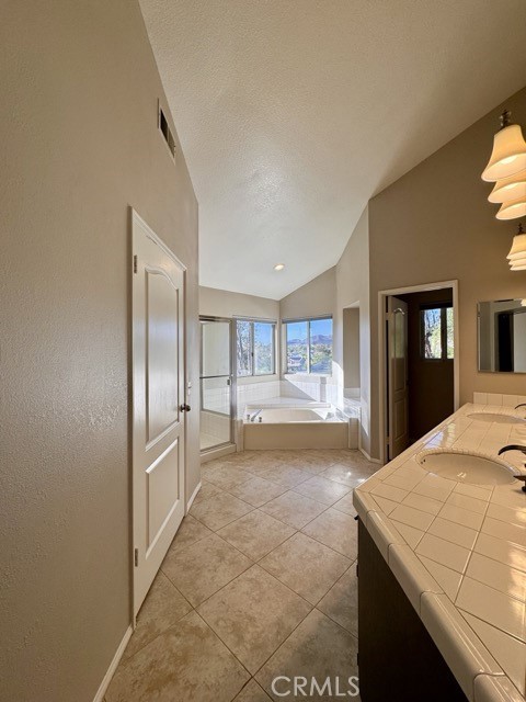 40085 Temecky Way Murrieta, CA 92562 - Photo 32 of 55 a kitchen with granite countertop a refrigerator and cabinets