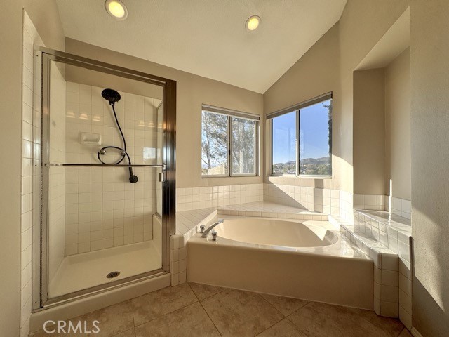 40085 Temecky Way Murrieta, CA 92562 - Photo 34 of 55 a bathroom with a bathtub and a shower