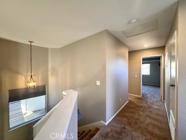 40085 Temecky Way Murrieta, CA 92562 - Photo 36 of 55 a view of a hallway view with wooden floor and staircase