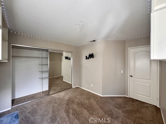 40085 Temecky Way Murrieta, CA 92562 - Photo 41 of 55 an empty room with closet and wooden floor