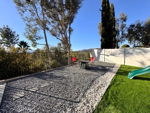 a view of a park with swings and slides