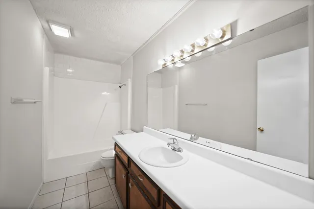 a bathroom with a sink double vanity and a mirror