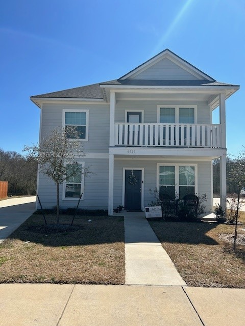 6959 Halter Loop College Station, TX 77845 - Photo 1 of 22 View of front of home featuring a balcony and covered porch