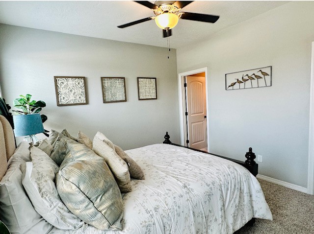 6959 Halter Loop College Station, TX 77845 - Photo 13 of 22 Carpeted bedroom with baseboards and ceiling fan